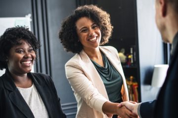 Business professionals shaking hands