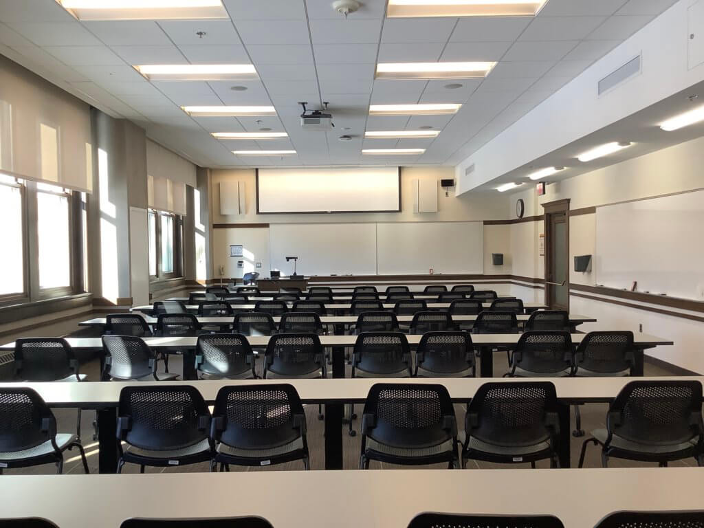 Rows of chairs in a neat and tidy classroom.