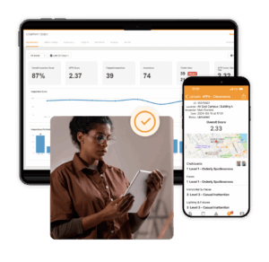 Facility team member using the OrangeQC cleaning standards app on a smartphone.
