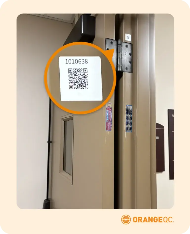 An illustration featuring a close-up of a QR code label on a door frame with a magnified inset, used for facility check-ins and employee visit tracking.